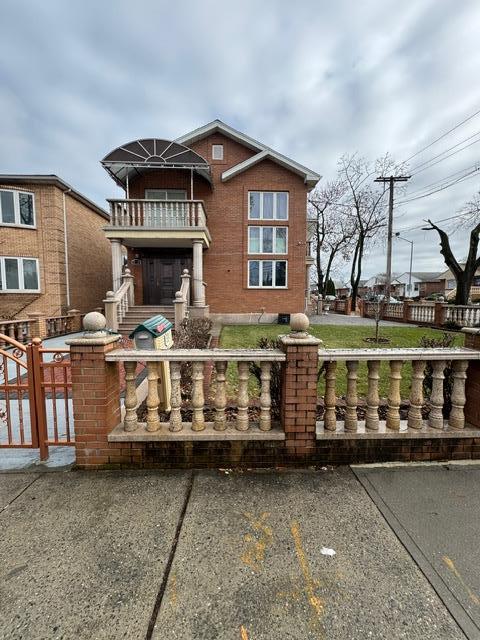 view of front of home with a balcony