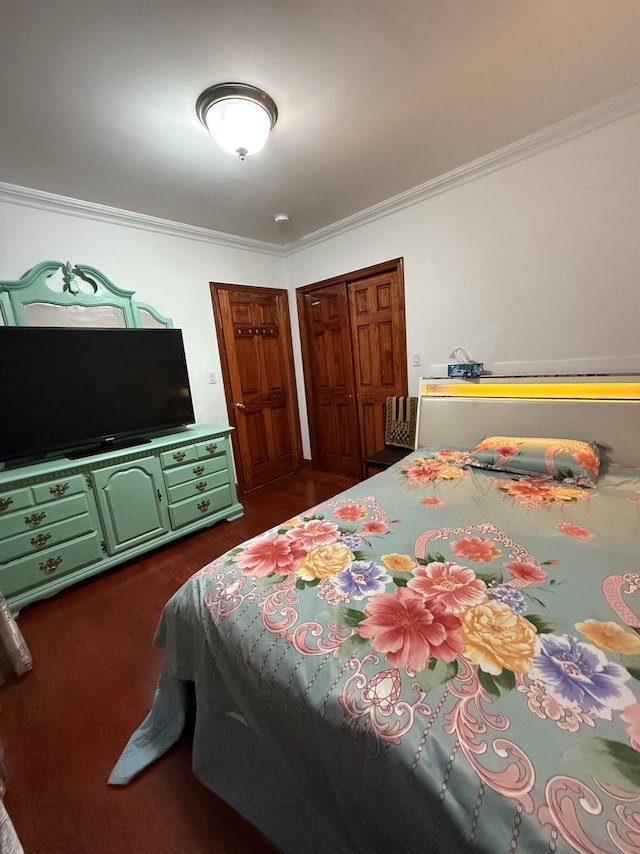 bedroom with a closet and crown molding