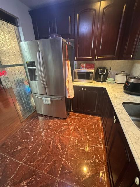 kitchen with sink and appliances with stainless steel finishes