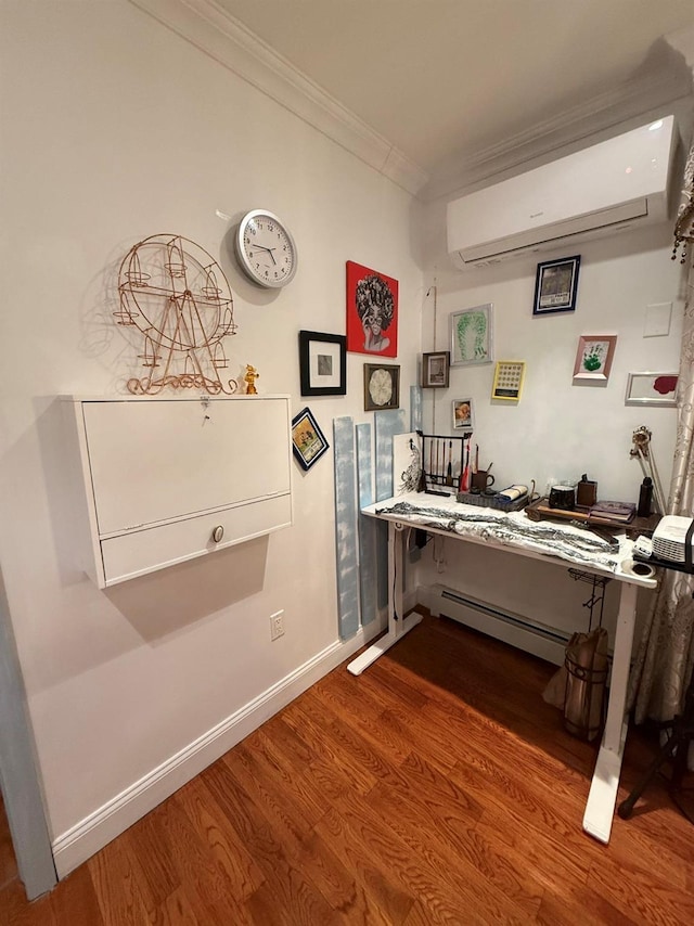 miscellaneous room with ornamental molding, a baseboard radiator, a wall mounted air conditioner, and wood-type flooring