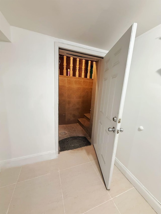 hallway with light tile patterned floors