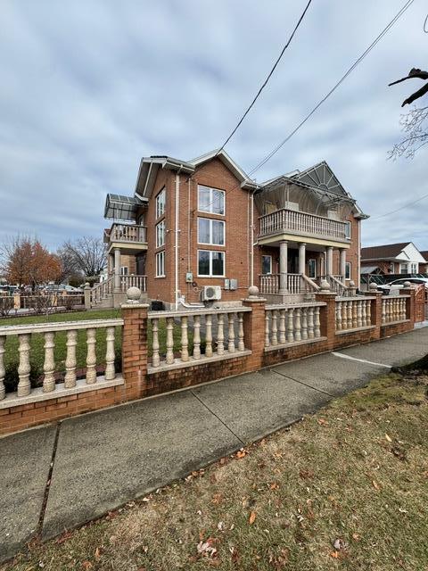 view of home's exterior with a balcony