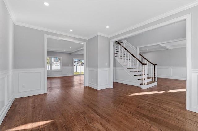 unfurnished living room with crown molding and dark wood-type flooring