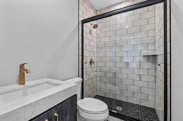 bathroom featuring vanity, toilet, and walk in shower