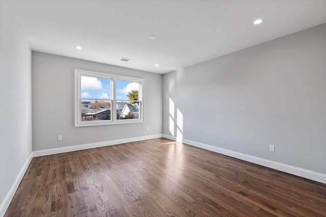 empty room featuring hardwood / wood-style floors