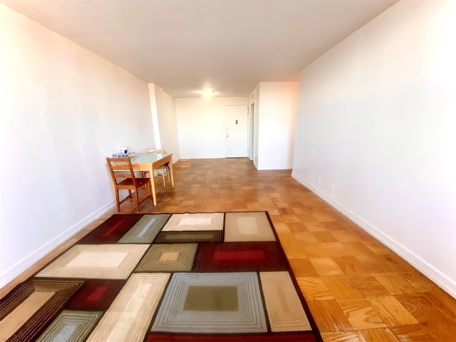 hallway featuring light parquet floors