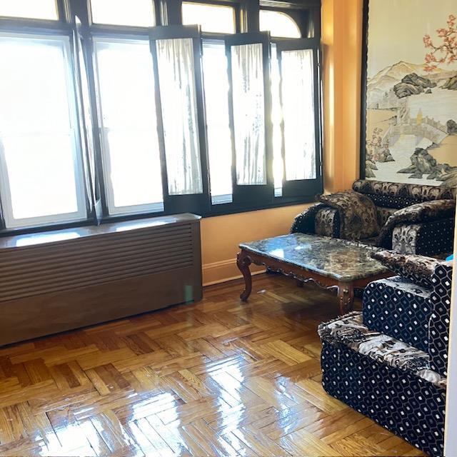 living area featuring parquet floors