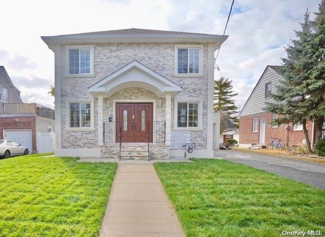 view of front of property with a front lawn