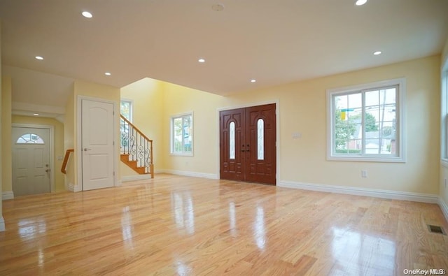 entryway with light hardwood / wood-style floors