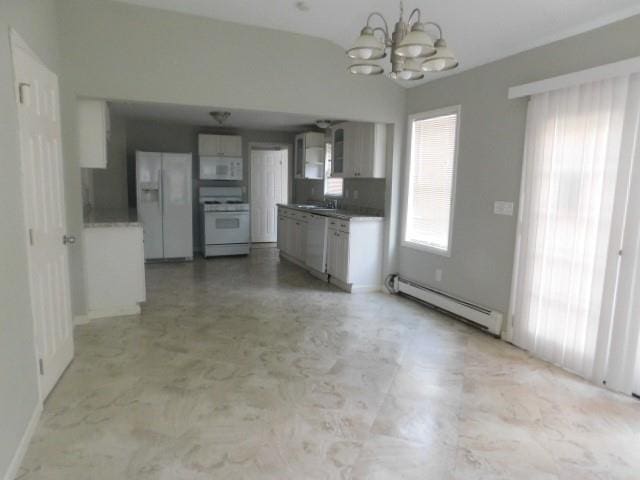 kitchen with a notable chandelier, hanging light fixtures, white appliances, and a baseboard heating unit