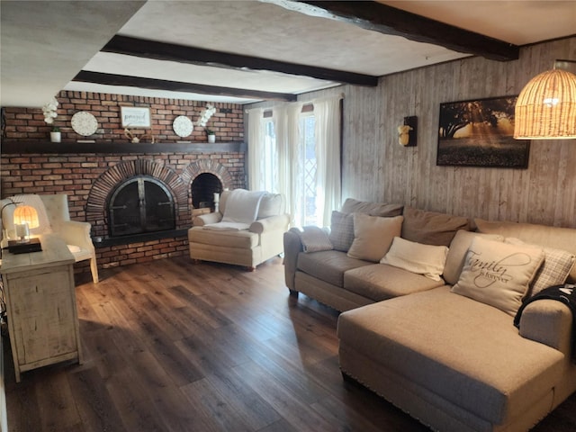 living room featuring beam ceiling, wood walls, a fireplace, and dark hardwood / wood-style floors