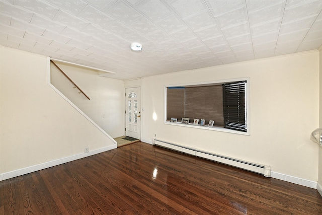 entrance foyer with a baseboard radiator and dark wood-type flooring