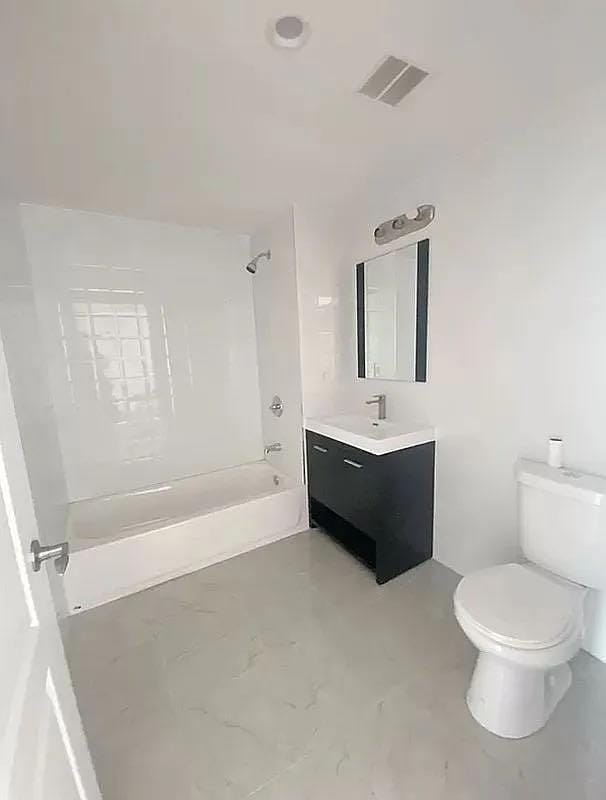 full bathroom with vanity, toilet, and tub / shower combination