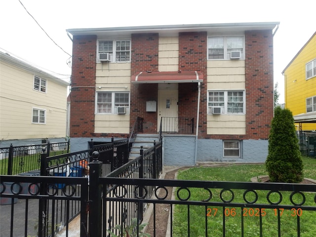 128 E 4th St, Mount Vernon, NY 10550 - traditional-style house featuring brick siding and a fenced front yard