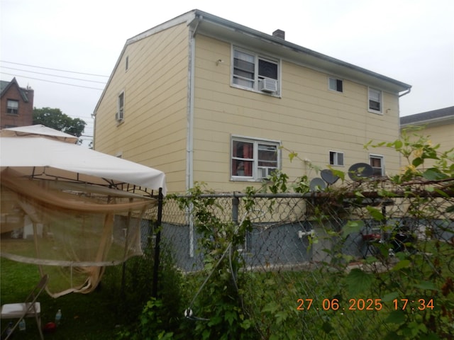 128 E 4th St, Mount Vernon, NY 10550 - view of side of property featuring a chimney and a gazebo