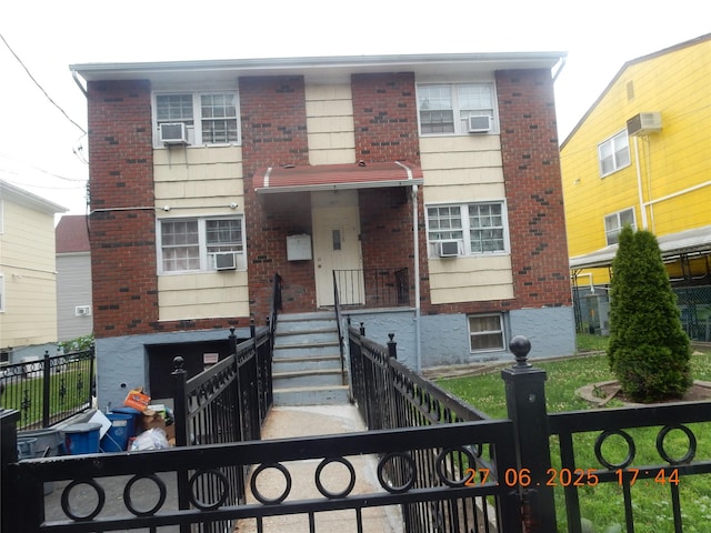 128 E 4th St, Mount Vernon, NY 10550 - traditional-style home featuring brick siding and a fenced front yard