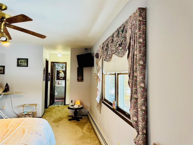 carpeted bedroom with ceiling fan, a closet, and a baseboard radiator