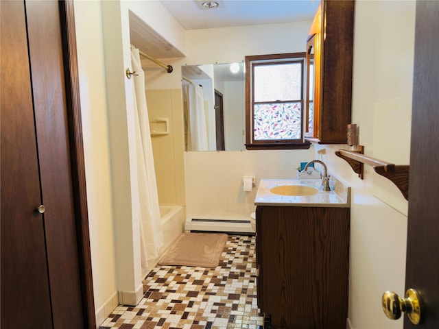 bathroom featuring vanity, shower / tub combo, and a baseboard radiator