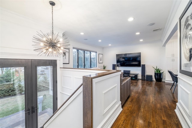 kitchen with hanging light fixtures, a chandelier, french doors, and ornamental molding