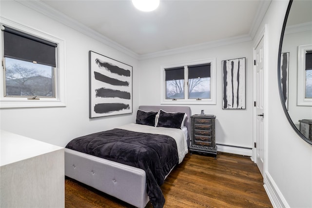 bedroom with dark wood-type flooring, baseboard heating, and crown molding