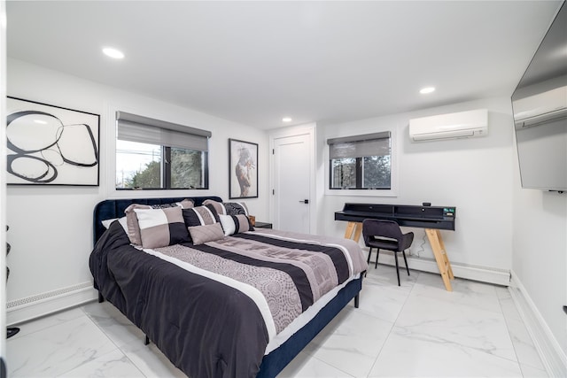 bedroom with a baseboard heating unit and a wall mounted AC