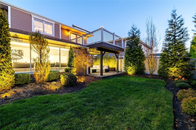 back of house with a patio area, a yard, and an outdoor hangout area