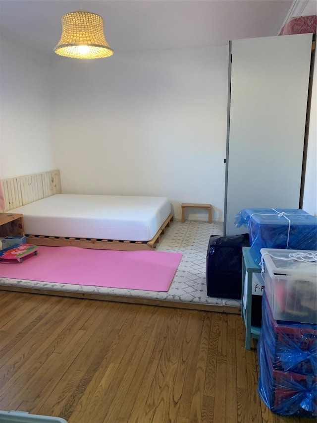 bedroom featuring hardwood / wood-style flooring