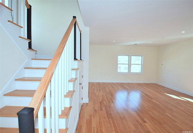 staircase featuring hardwood / wood-style flooring