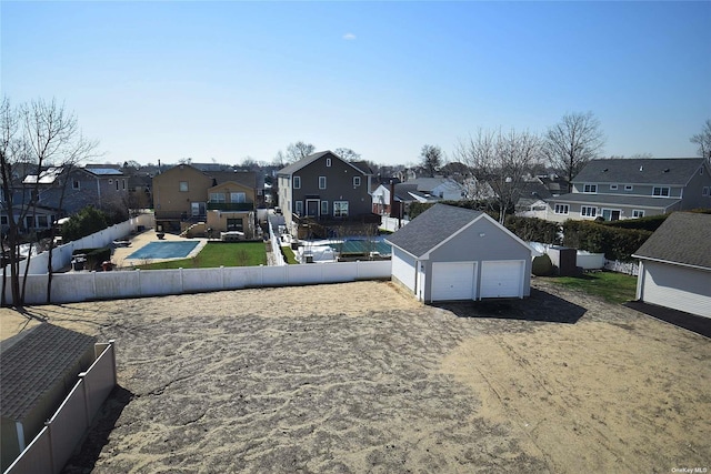 view of yard with an outbuilding and a garage