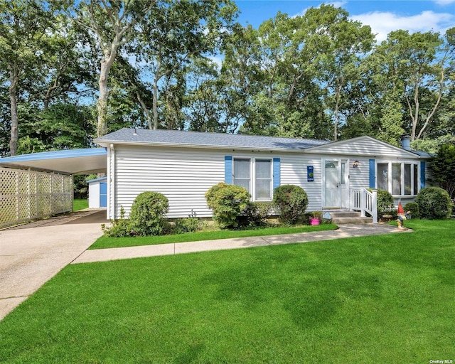 ranch-style home with a front yard and a carport