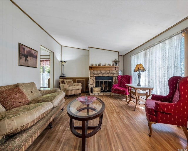 living room featuring a fireplace, wood-type flooring, and lofted ceiling