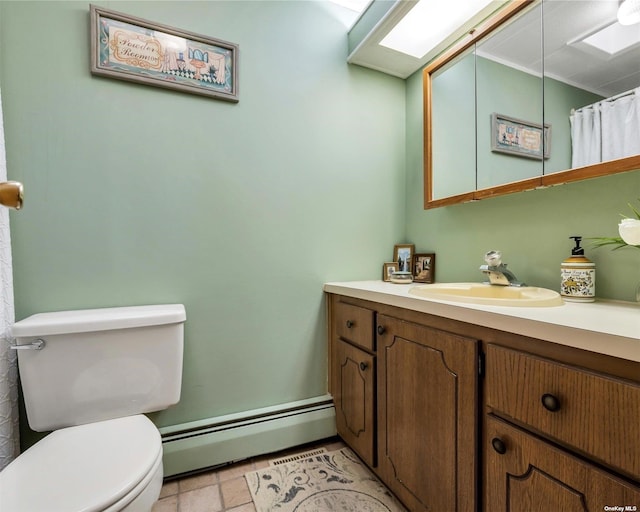 bathroom featuring vanity, toilet, and a baseboard radiator