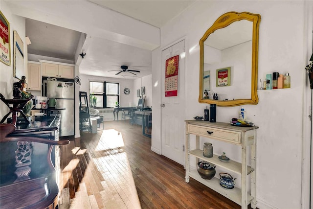 hallway with hardwood / wood-style flooring