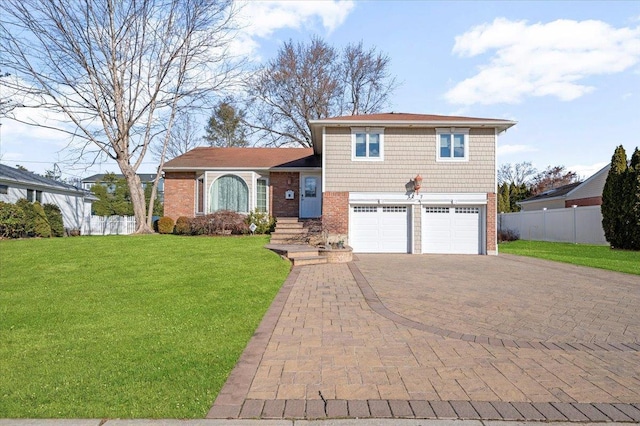 view of front of home featuring a front lawn and a garage