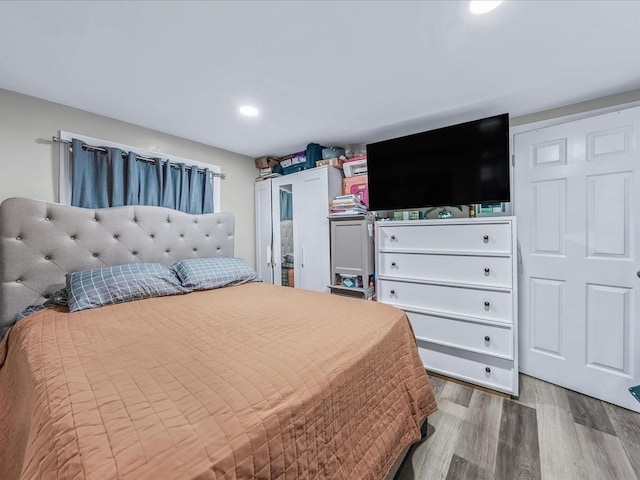 bedroom with hardwood / wood-style floors