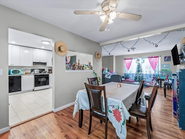 dining area featuring ceiling fan and light hardwood / wood-style flooring