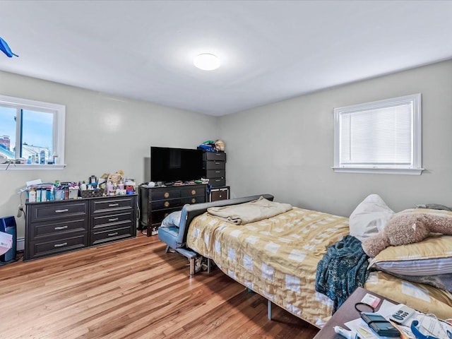 bedroom with hardwood / wood-style flooring