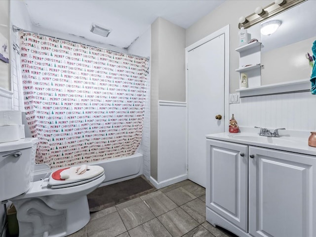 full bathroom featuring shower / bath combination with curtain, vanity, and toilet