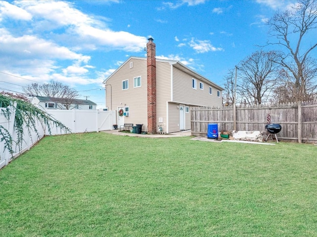 back of house with a yard