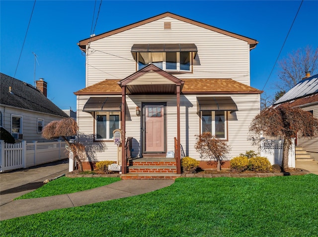 front facade featuring a front yard