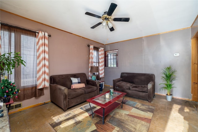 living room featuring ceiling fan and ornamental molding