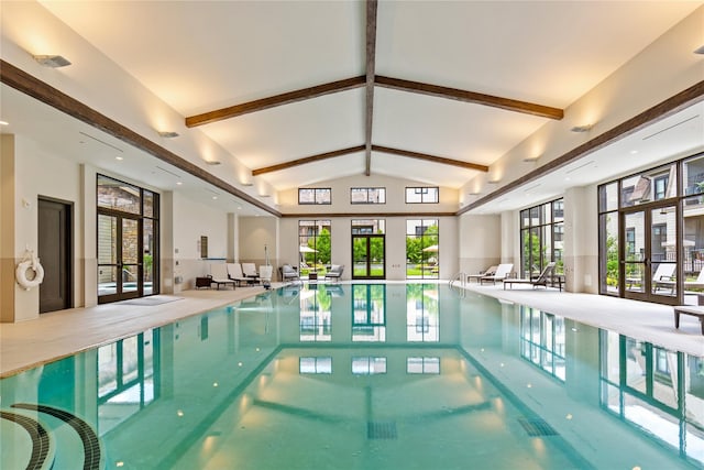 view of pool with french doors and a hot tub