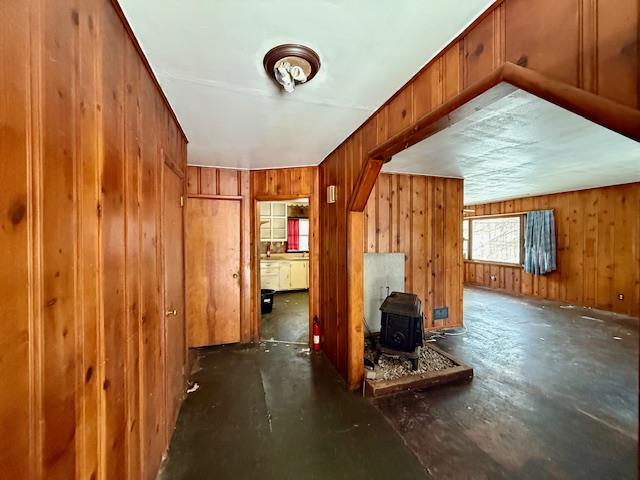 bonus room featuring wooden walls