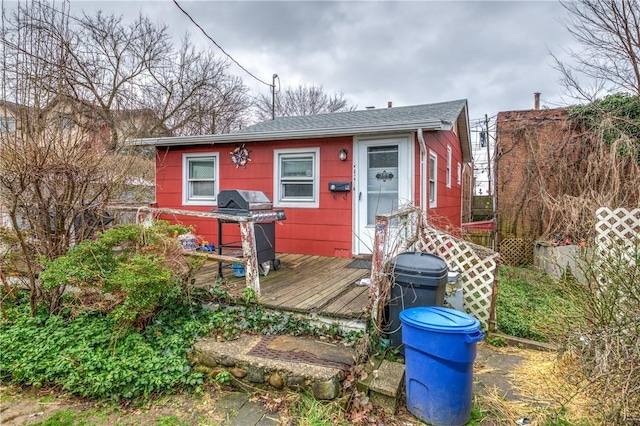 view of front of property with a wooden deck