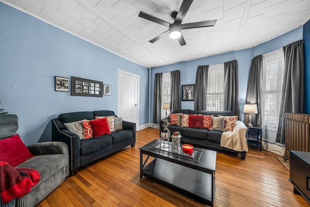 living room with hardwood / wood-style flooring and ceiling fan