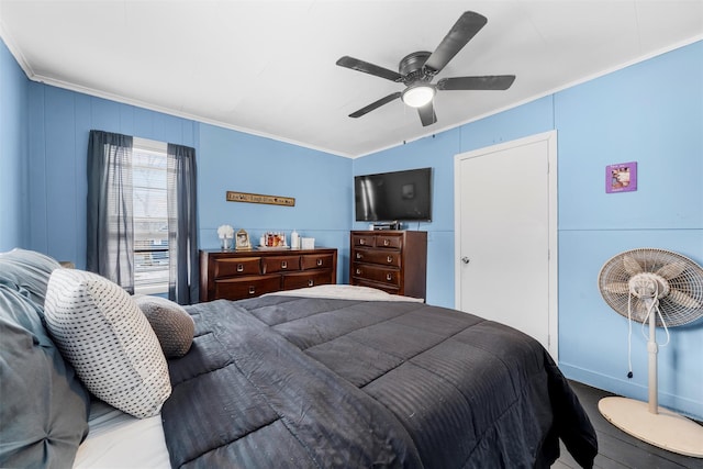 bedroom with ceiling fan and crown molding