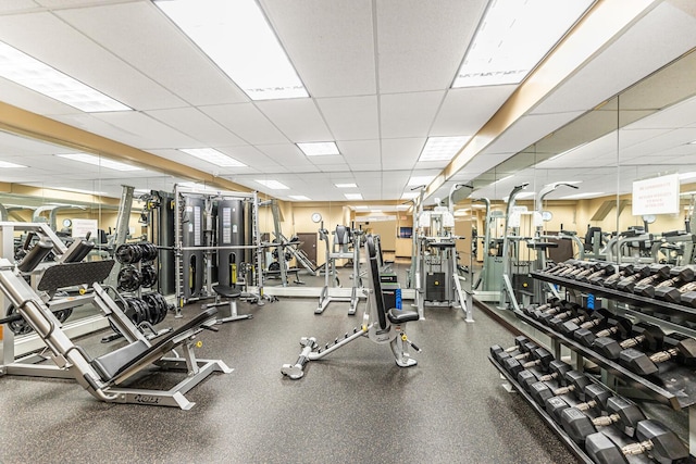 exercise room with a paneled ceiling