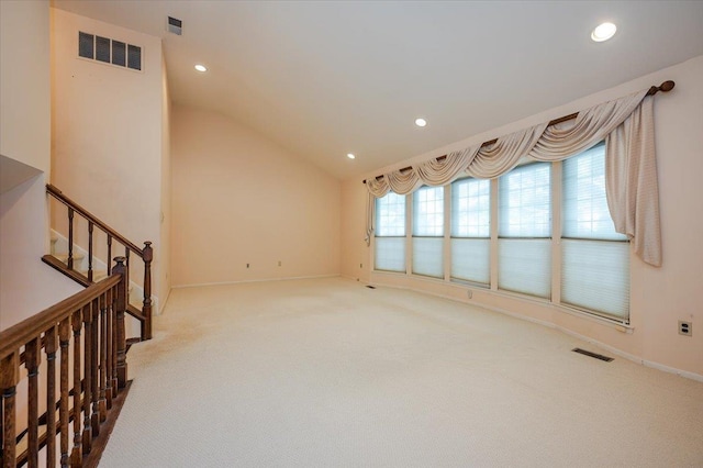 living room featuring lofted ceiling and carpet flooring