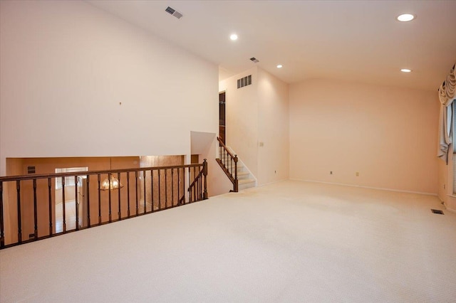 unfurnished room with carpet floors and a chandelier