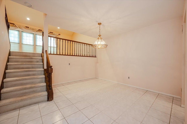 interior space featuring a notable chandelier and light tile patterned flooring